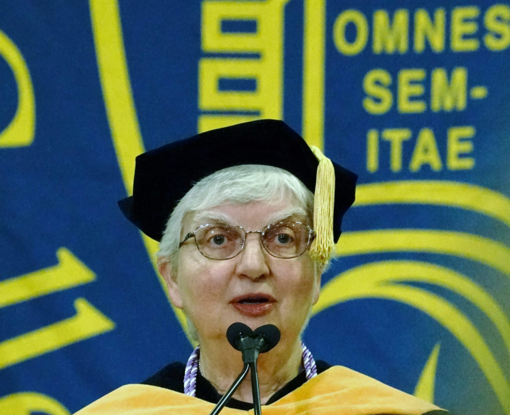 Sister Beverly Raway, Prioress, welcomes the new College president.