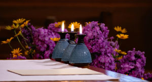 The oil lamp recalls the seven wise virgins and signifies a faithful life in service to God.